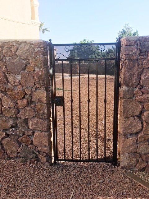 Wrought iron metal gate fence installation in El Paso TX